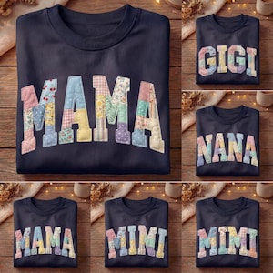 May include: Navy blue sweatshirt with the word "MAMA" in patchwork letters. The letters are made of various floral and patterned fabrics. Additional sweatshirts feature "GIGI", "NANA", and "MIMI" in similar styles.