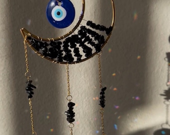 Atrapasueños con forma de luna de cristal celestial de obsidiana con colgante de cristal de ojo turco.