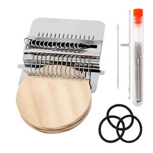 May include: A metal weaving loom with wooden components, needles, and a tube of needles. The loom has a series of hooks and a wooden base. Also included are three black rubber bands. The needles are in a clear tube with an orange cap.