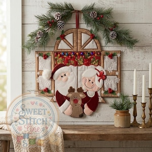 May include: A festive Christmas wall hanging depicting Santa Claus, Mrs. Claus, and a reindeer, framed within a decorative window. The design includes seasonal details such as pine boughs, pinecones, and red berries, evoking a holiday ambiance.