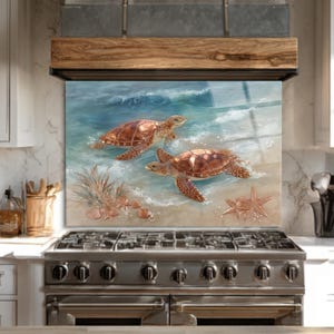 May include: A kitchen splashback with an ocean scene, depicting two sea turtles in the waves. The artwork includes seashells and a starfish on the sandy shore, with a colour palette of blues, browns, and beige.