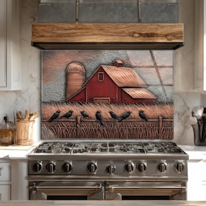 May include: A decorative kitchen backsplash featuring a rural scene. A red barn and silo are depicted in a textured style, with a fence and birds in the foreground. The artwork is framed by a wooden accent above a stainless steel stove.