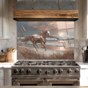 May include: A decorative kitchen backsplash featuring a metallic horse galloping on a beach. The artwork depicts a horse running near the ocean with tall grass and a sunset in the background. The color palette includes shades of brown, beige, and blue.