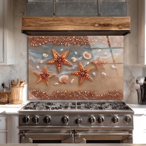 May include: A decorative kitchen backsplash featuring a beach scene with starfish and seashells. The artwork has a brown, tan, and blue color palette. The backsplash is installed above a stainless steel gas range.