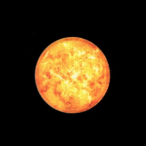 May include: A vibrant, circular design resembling a sun, rendered in shades of yellow, orange, and red against a stark black background. The sun's surface has a textured appearance, with small, evenly spaced dots.