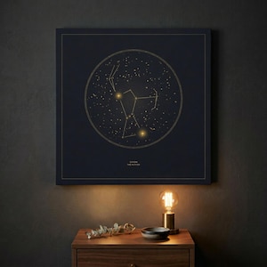 May include: A dark blue square canvas print featuring a gold constellation design within a circular frame. The constellation is labeled "Orion the Hunter" in gold text. The print is displayed above a wooden nightstand.