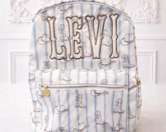 Mochila con bordado personalizado de vaquero