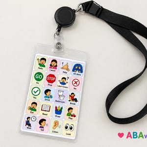 Puede incluir: Un tarjetero de comunicación de plástico transparente con una cuadrícula de iconos coloridos y etiquetas de texto que incluyen Hello, I want, Help, All done, Go, Stop, I don't know, No, Yes, Drink, Bathroom, Break, Eat, Read, Draw, Play, Wait, Tell, Listen y Look.