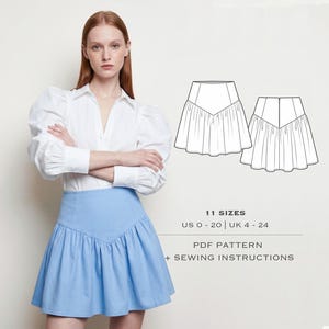 May include: A light blue mini skirt with a V-shaped waistline and a ruffled hem. The skirt is paired with a white button-down shirt with puffed sleeves. The image also includes a line drawing of the skirt and text that reads "11 Sizes" and "PDF Pattern + Sewing Instructions."