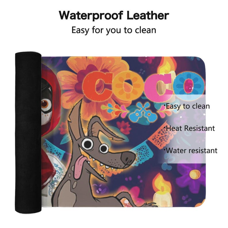 May include: A rolled-up, black mat featuring a colorful design from the movie "Coco." The design includes the word "Coco" in bright colors, a cartoon dog, and floral and candle illustrations. The text "Waterproof Leather" and "Easy to clean" are also visible.