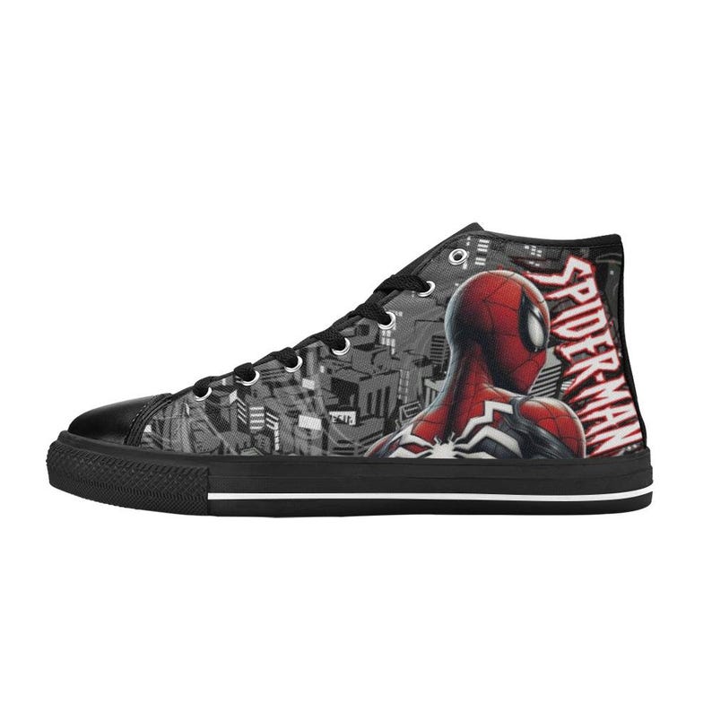 May include: High-top canvas sneaker featuring a Spider-Man design. The shoe has a black sole, laces, and toe cap. The side displays Spider-Man in red and black, with the words "Spider-Man" in white.