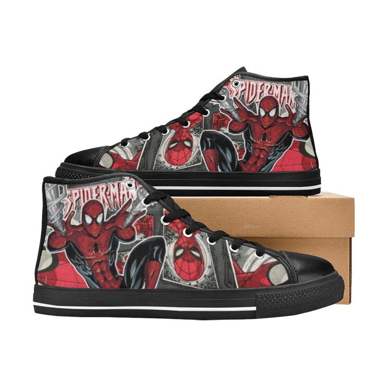 May include: High-top sneakers featuring a red and black Spider-Man comic book graphic print. The shoes have black laces, black toe caps, and black soles with a thin white stripe. The word Spider-Man is printed in white lettering on the side.