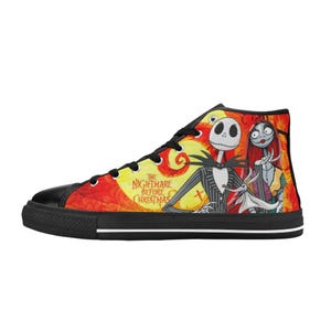 May include: A high-top sneaker featuring a vibrant orange and yellow background with a graphic print of Jack Skellington, Sally, and Zero from The Nightmare Before Christmas. The shoe has black laces, a black toe cap, and a black rubber sole.