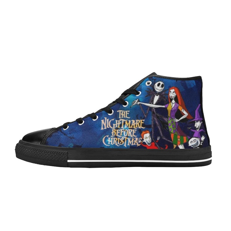 May include: A high-top sneaker featuring a blue background with a graphic print of characters from The Nightmare Before Christmas. The shoe has black laces, a black toe cap, a black sole with a white stripe, and the movie title text in yellow.