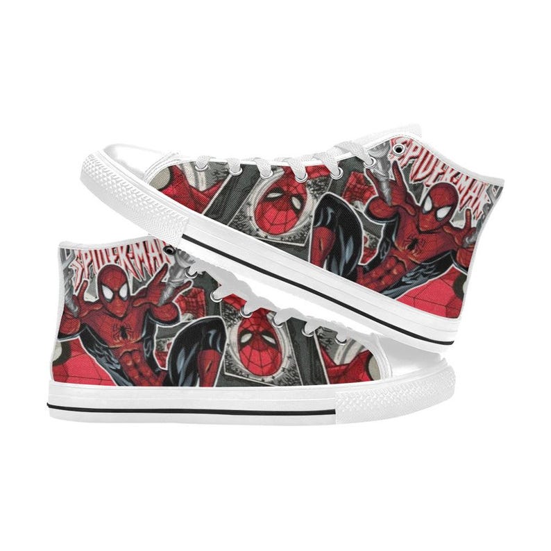 May include: High-top sneakers featuring a red and black comic book print of Spider-Man. The shoes have white laces, white rubber toe caps, and white soles with a thin black stripe. The word SPIDER-MAN is printed in red on the canvas fabric.