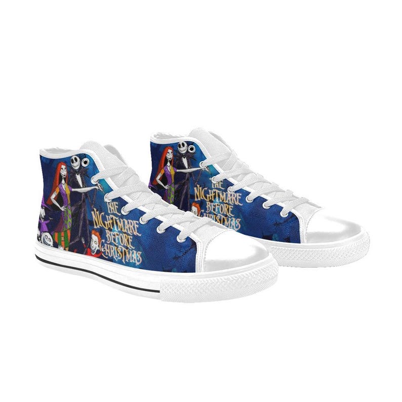 May include: High-top canvas sneakers featuring a blue background with a printed graphic of characters from The Nightmare Before Christmas. The shoes have white laces, white rubber toe caps, and white rubber soles with black trim detailing.
