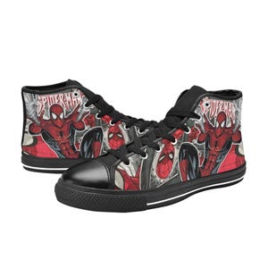 May include: High-top sneakers featuring a red and black Spider-Man comic book graphic print. The shoes have black laces, black eyelets, a black toe cap, and a black rubber sole. The word Spider-Man is printed in white text on the side panels.