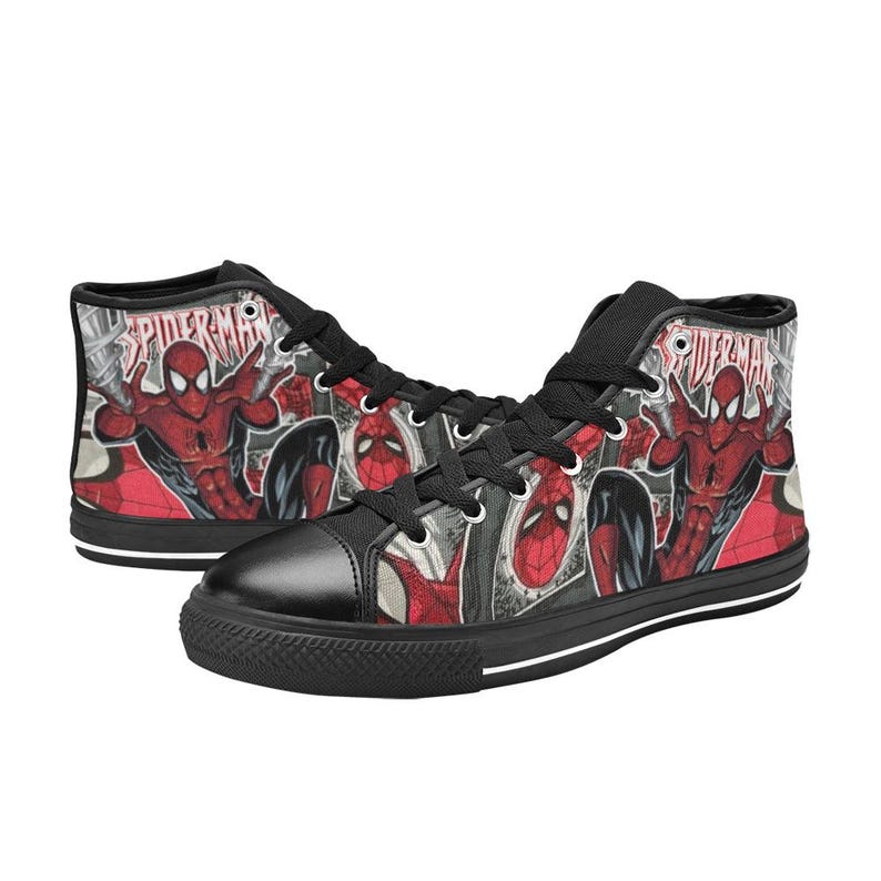 May include: High-top sneakers featuring a red and black Spider-Man comic book graphic print. The shoes have black laces, black eyelets, a black toe cap, and a black rubber sole. The word Spider-Man is printed in white text on the side panels.