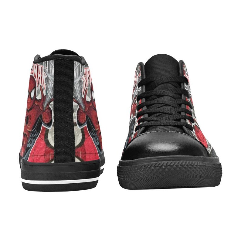 May include: A pair of high-top sneakers featuring a red and black Spider-Man comic book graphic print. The shoes have black laces, black toe caps, and black soles with a thin white stripe. The design includes the Spider-Man logo and character.