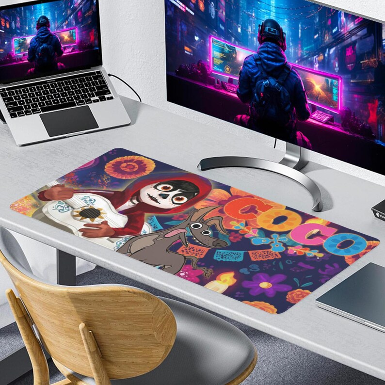 May include: A rectangular mousepad featuring a colorful design from the movie Coco. The design includes the character Miguel playing a guitar, a dog, and the word "Coco" in vibrant letters. The background is a dark blue with floral and decorative elements.