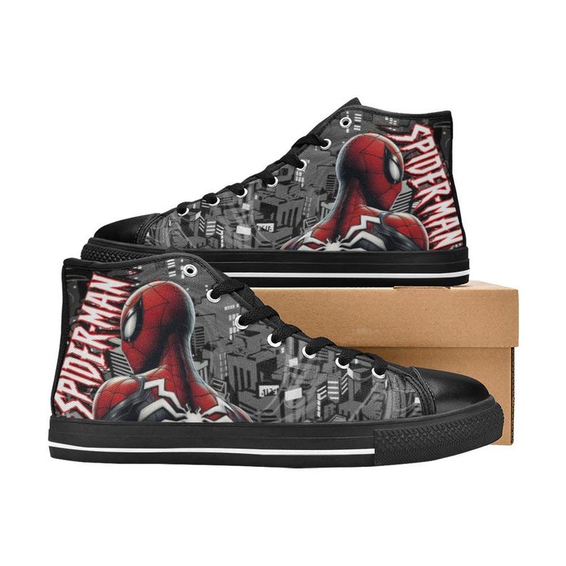 May include: Pair of high-top canvas sneakers featuring a Spider-Man design. The shoes have a black toe cap, laces, and sole. The sides display a red and black Spider-Man graphic against a gray cityscape background, with "SPIDER-MAN" text.