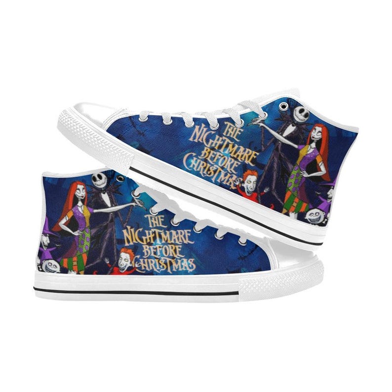 May include: High-top sneakers featuring a blue background with a graphic print of characters from The Nightmare Before Christmas. The design includes Jack Skellington and Sally, white laces, white eyelets, and a white rubber toe cap and sole.
