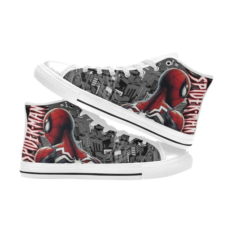 May include: White high-top sneakers featuring a Spider-Man design. The sneakers have a red and black Spider-Man graphic on the sides, with the word "Spider-Man" printed in red. The background is a gray and black cityscape.