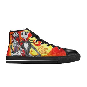 May include: A high-top sneaker featuring a vibrant yellow and red background with a graphic print of Jack Skellington, Sally, and Zero from The Nightmare Before Christmas. The shoe has black laces, a black toe cap, and a black sole with a white stripe.