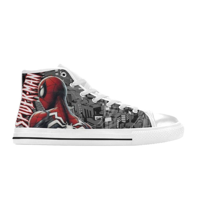 May include: White high-top canvas sneakers featuring a Spider-Man design. The shoe has a red and black Spider-Man graphic on the side, with the word "SPIDER-MAN" in red. The background is a grayscale cityscape.