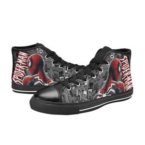 May include: Pair of high-top canvas sneakers featuring a Spider-Man design. The shoes are black with a red and white Spider-Man graphic on the sides and the text "SPIDER-MAN". The soles are black with a white stripe.
