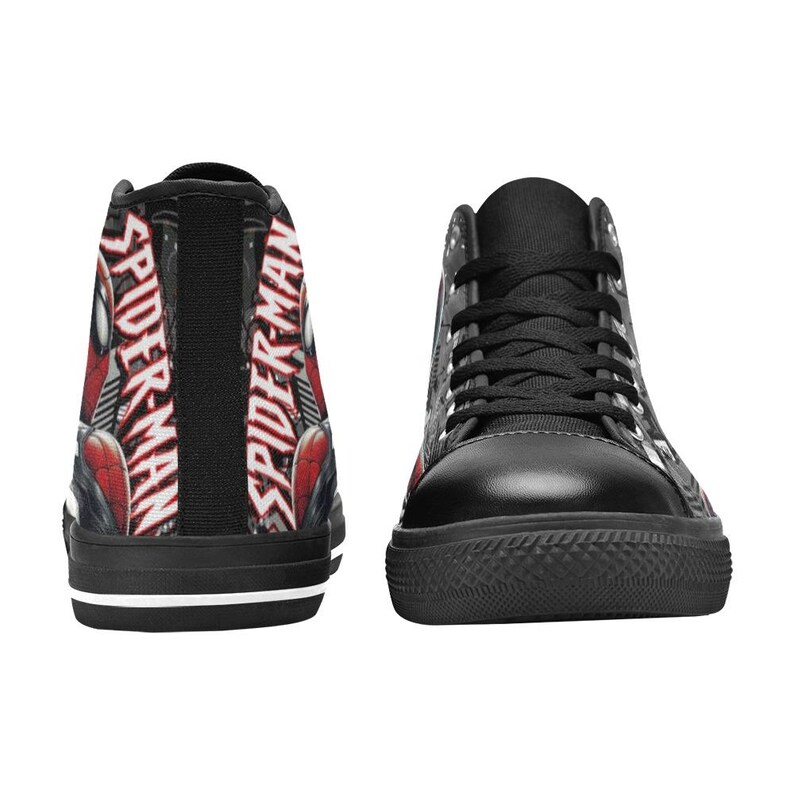 May include: Black high-top sneakers featuring a Spider-Man design. The sneakers have black laces, a black sole, and the words "SPIDER-MAN" printed on the back in red and white. The design includes red and black accents.
