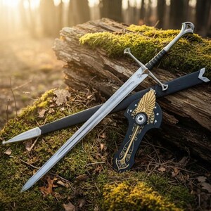 May include: A silver sword with a black handle and crossguard rests on a moss-covered log. A black scabbard and a decorative shield with gold accents are also present. The scene is set outdoors with sunlight filtering through the trees.