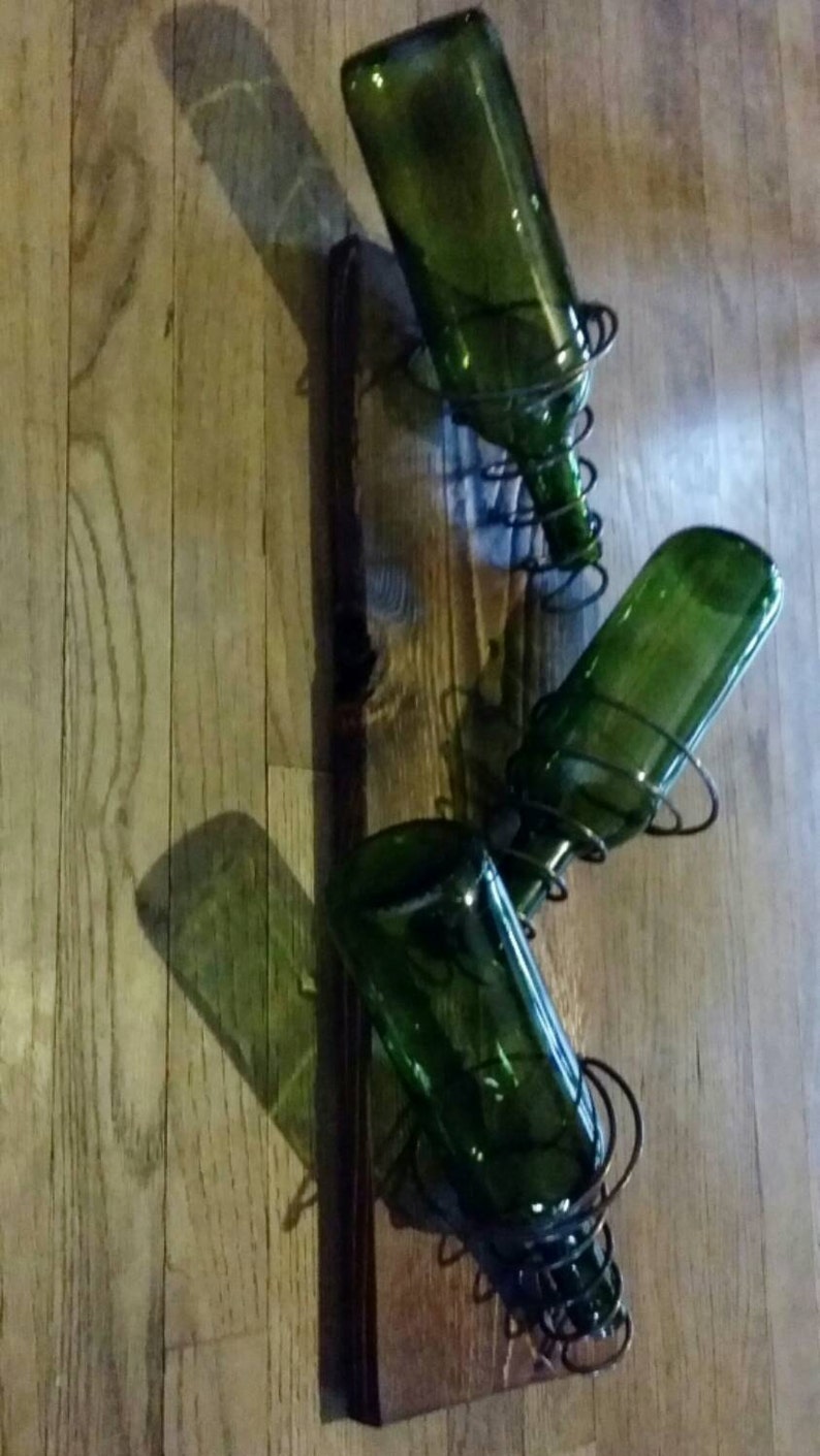 Wall mounted wine rack made with found wood and bed springs Etsy