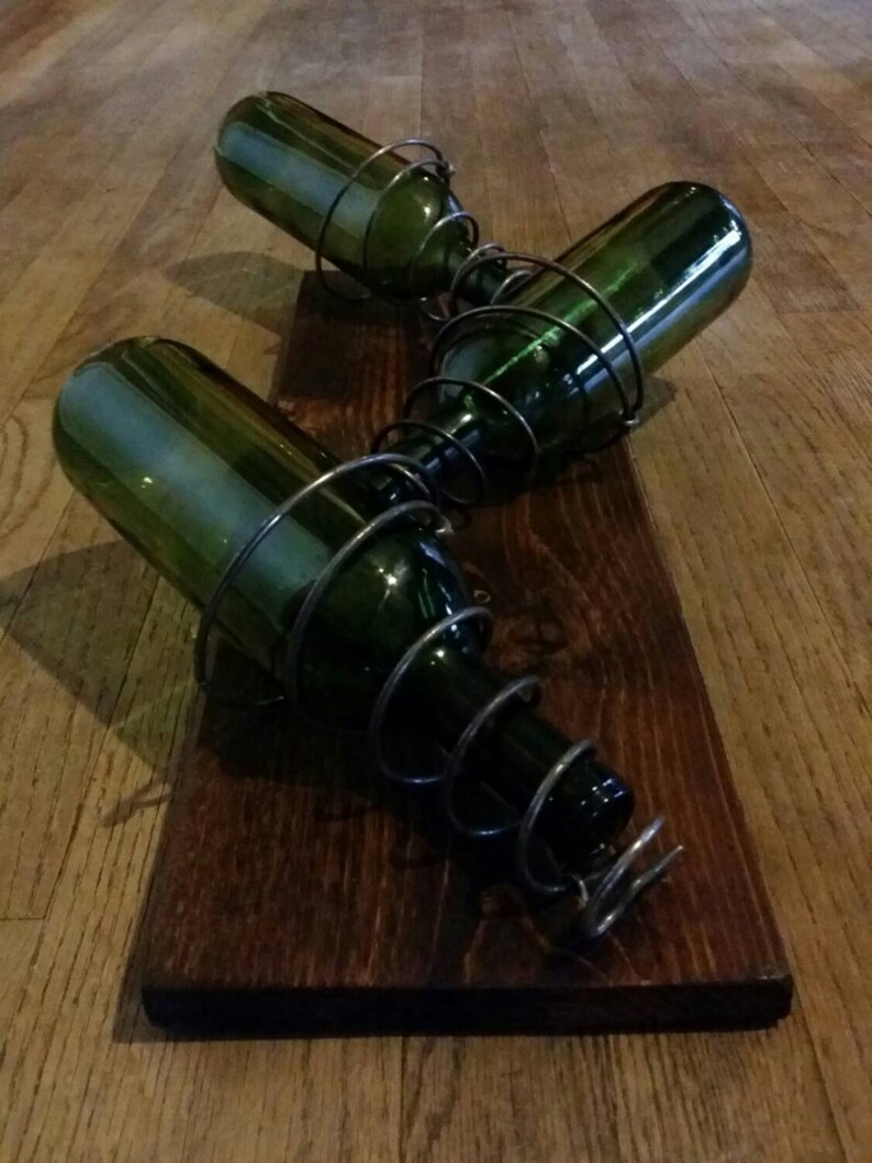 Wall mounted wine rack made with found wood and bed springs Etsy