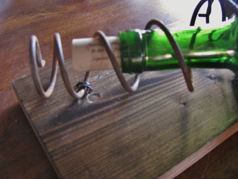 Wall mounted wine rack with bed spring holders Etsy