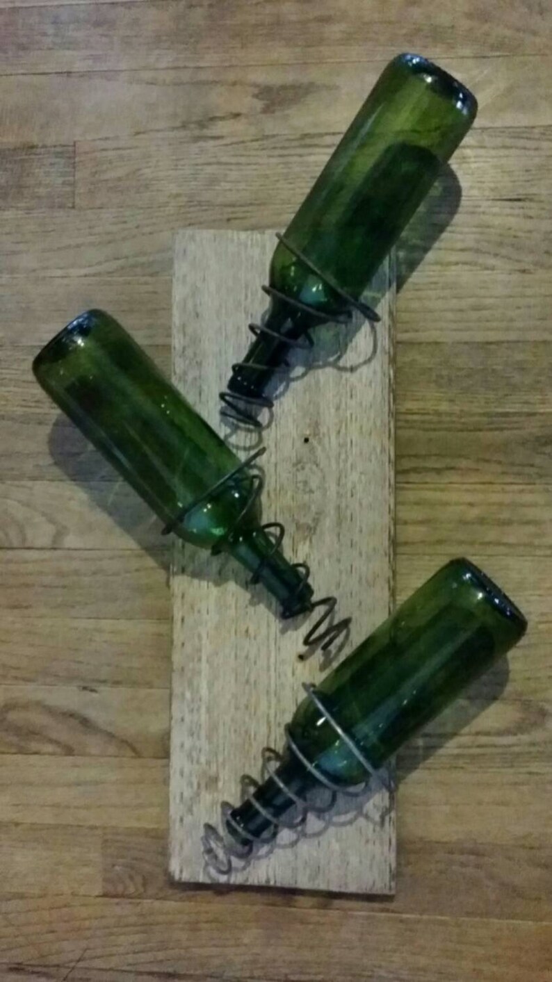 Wall mounted wine rack made with bed springs and found wood Etsy