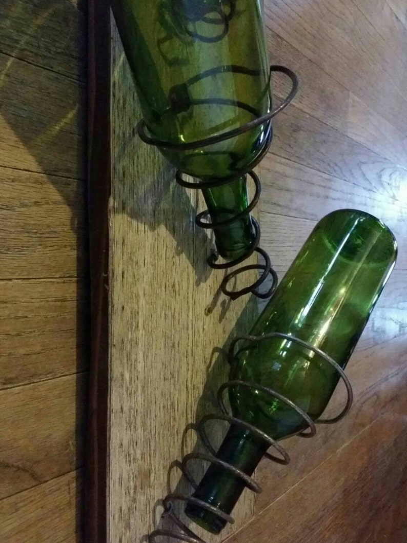 Wall mounted wine rack made with bed springs and found wood Etsy