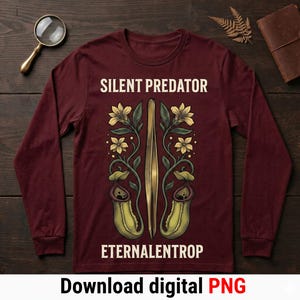 Puede incluir: Camiseta burdeos de manga larga con un diseño botánico. El diseño presenta un par de pinzas, flores amarillas y plantas carnívoras. El texto de la camiseta dice "SILENT PREDATOR" y "ETERNALENTROP".
