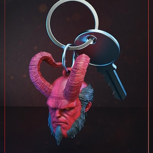 May include: A white ceramic mug with a black handle and the text "But First, Coffee" in a bold, black font. The mug is set against a blurred background, suggesting a cozy setting.