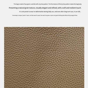 May include: Close-up of premium top-grade cowhide leather. The leather has a natural grain texture with a lychee pattern. The text in the image says the leather is visually elegant and refined, with a soft and resilient touch.