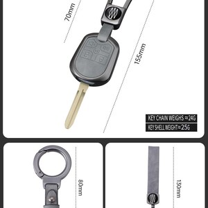 May include: A key fob with a zinc alloy and leather design, measuring 155mm in length. The key fob has a key chain that weighs approximately 24g and a key shell that weighs approximately 25g. The image also shows a circle buckle and a bracelet clasp.