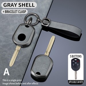 May include: Gray car key shell with a bracelet clasp. The key shell has a metallic finish and a key blade. The image includes the text "GRAY SHELL + BRACELET CLASP" and "5 BUTTONS".