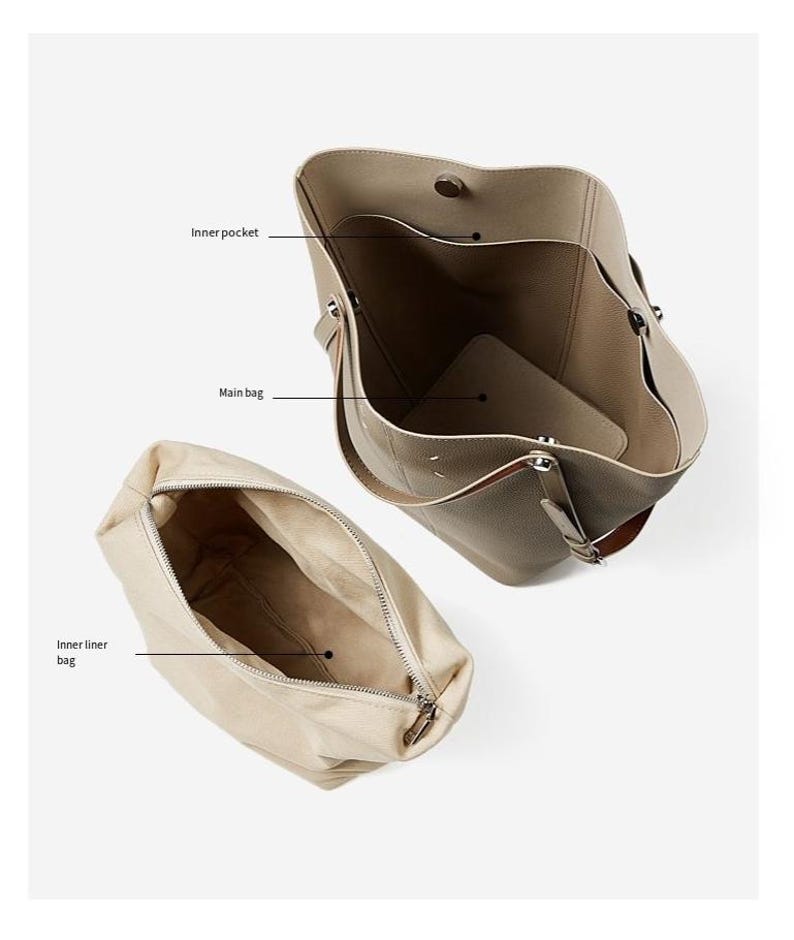 May include: A taupe tote bag with an open top, revealing an inner pocket and main bag compartment. A separate beige inner liner bag with a zip is also shown. The bag is made of a soft material.