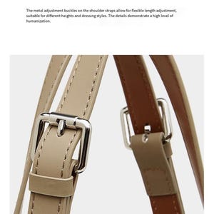May include: Close-up of beige leather shoulder straps with silver metal adjustment buckles. The image text reads "Shoulder strap hardware adjustment buckle". The straps are designed for flexible length adjustment, suitable for different heights.