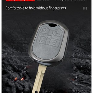 May include: A car key with a protective case. The key has a silver blade and a gray key fob with buttons. The text on the image reads: "ANTI-COLLISION AND ANTI-SCRATCH PROTECT THE KEY FROM HARM".