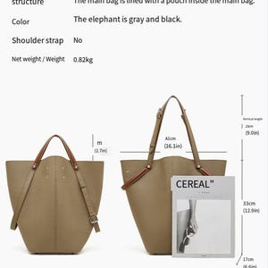 May include: A gray and black handbag made from top layer cowhide. It can be carried by hand or over the shoulder. The bag is 41cm wide, 23cm high, and 33cm deep. It has an internal pouch and weighs 0.82kg.