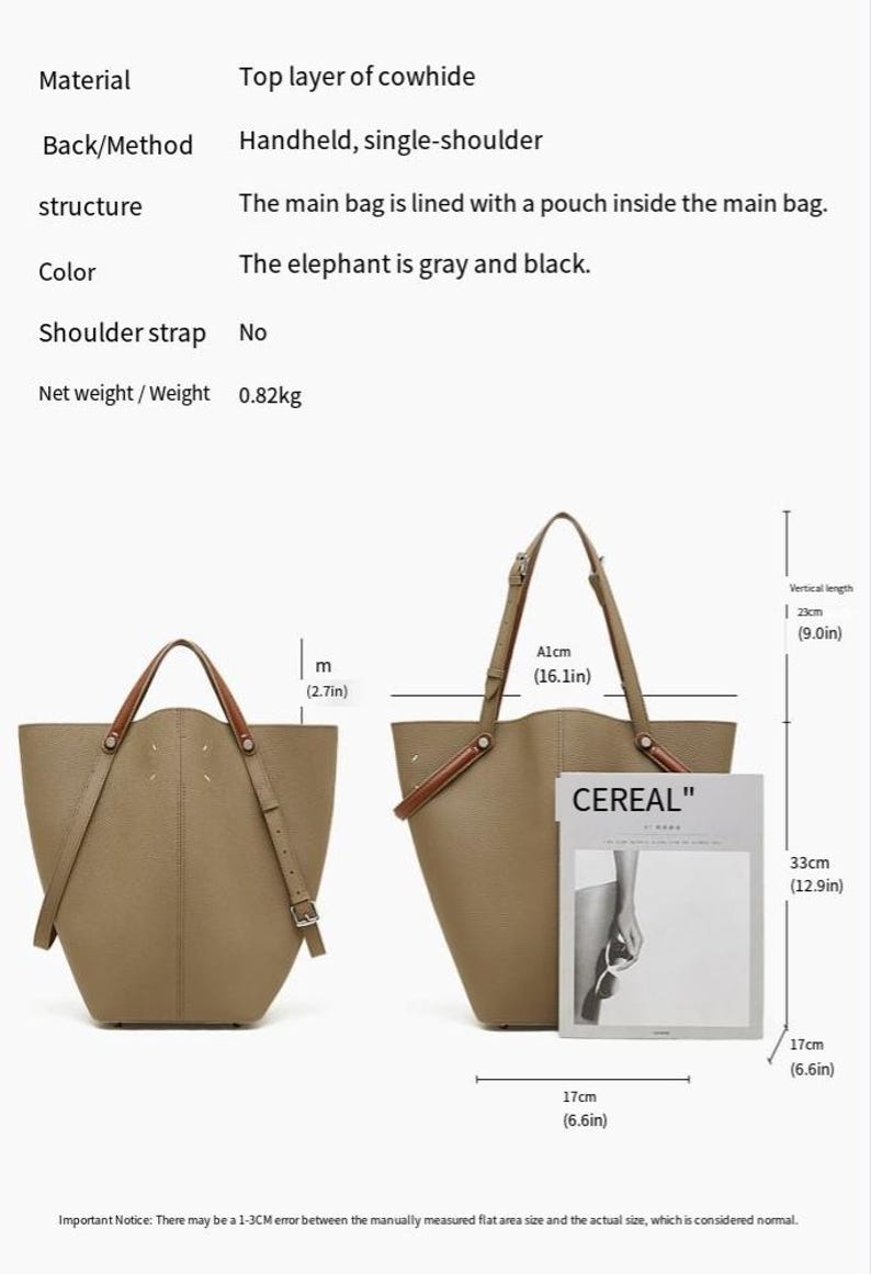 May include: A gray and black handbag made from top layer cowhide. It can be carried by hand or over the shoulder. The bag is 41cm wide, 23cm high, and 33cm deep. It has an internal pouch and weighs 0.82kg.
