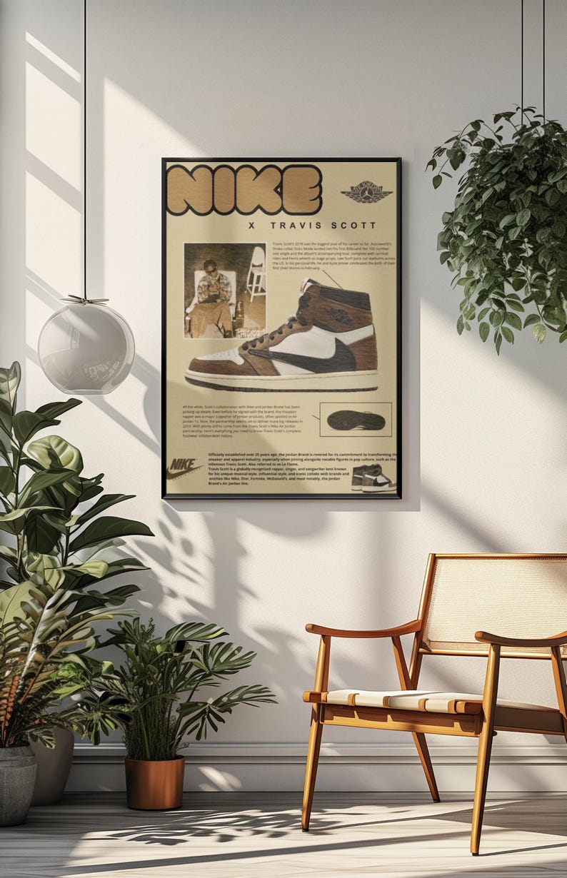 May include: A framed poster featuring a Nike X Travis Scott sneaker design. The poster has a beige background with the Nike logo in a brown, blocky font. The sneaker is brown, white, and black. The poster includes a photo of Travis Scott and text.