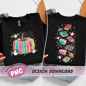 May include: A black sweatshirt featuring a graphic of a pumpkin made from colorful books with small ghosts and stars. The back design displays a vertical arrangement of various books, a golden crown, a sword, and a mask, surrounded by ghosts and stars.