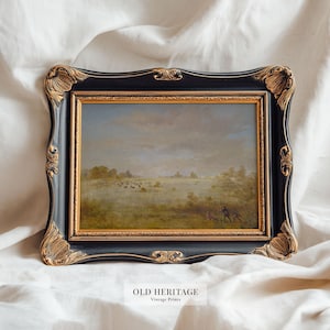 May include: An antique landscape painting in a black and gold ornate frame. The artwork depicts a pastoral scene with figures, fields, and a cloudy sky. The frame has decorative gold accents. The text "OLD HERITAGE Vintage Prints" is at the bottom.